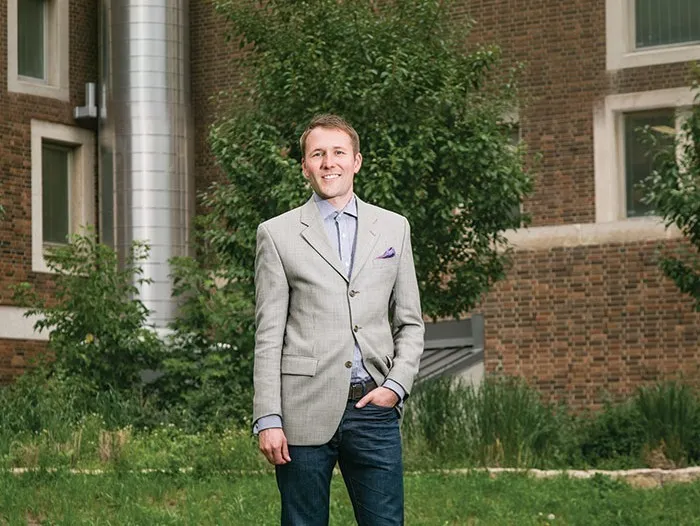 Matthew Grimes standing outdoors on campus