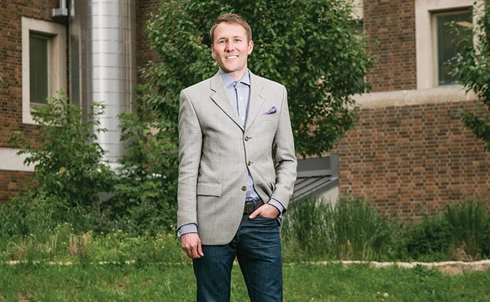 Matthew Grimes standing outdoors on campus